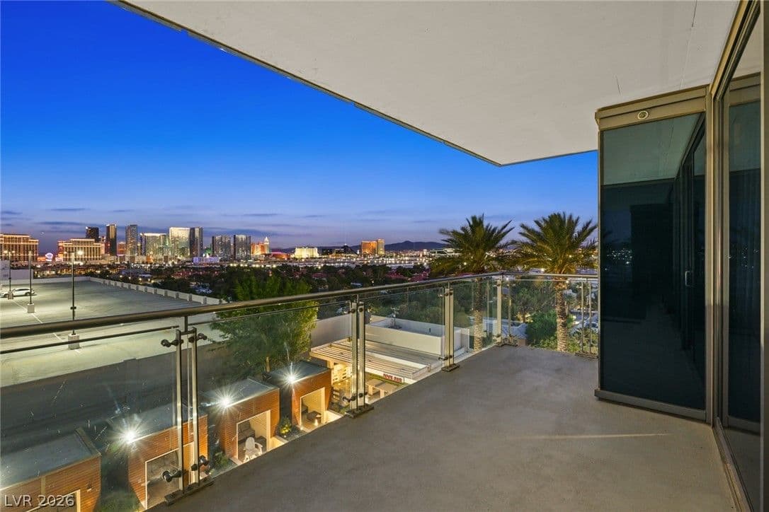Palms Place #8322 balcony overlooking the Las Vegas Strip Palms Place unit 8322 balcony with glass railing and panoramic Las Vegas Strip skyline at twilight